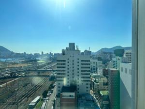 a view of a city from a building at Toyoko Inn Busan Station No.1 in Busan