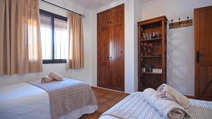 Postel nebo postele na pokoji v ubytování Cortijo Antonio