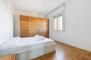Ένα ή περισσότερα κρεβάτια σε δωμάτιο στο Elegant Milan Apartment in Restocco Area