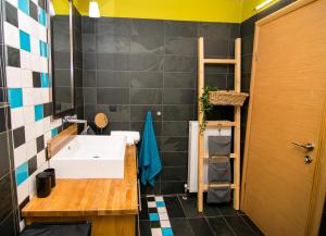 a bathroom with a white sink and a shelf at Villa Porgio Mountain View in Serres