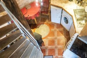 an overhead view of a kitchen with a washing machine at Le Pigeonnier - Piscine - Jardin - Calme in Labastide-de-Lévis