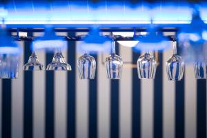 a group of wine glasses sitting on a machine at Smart Hotel Napoli in Naples