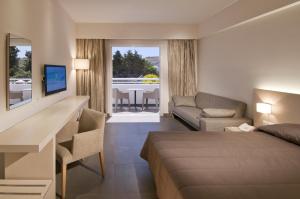 Postel nebo postele na pokoji v ubytování Platanista Hotel