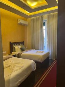 Postel nebo postele na pokoji v ubytování Cairo Dream Boutique Hotel