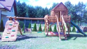 a playground with a slide and a play structure at Agroturystyka nad Wdą in Wieck