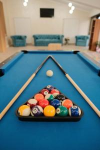 a pool table with cue balls in the middle at Pensiune Agroturistica Molidu in Almaş