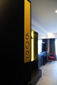 a mirror in an office with the word office on it at SO City Hotel Adults Only in St. Julianʼs