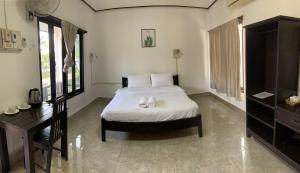 Una cama o camas en una habitación de Diamond Villa Vang Vieng