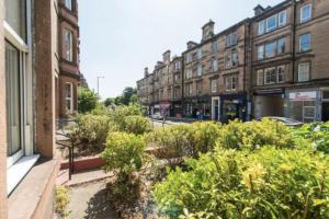 a view of a street with buildings and plants at Spare Room Stay in Edinburgh
