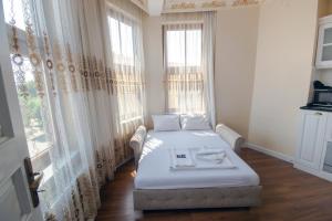 En eller flere senge i et værelse på IQ Hotel Galatasaray