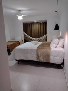 a bedroom with a bed and a couch at Sítio Werly in Domingos Martins