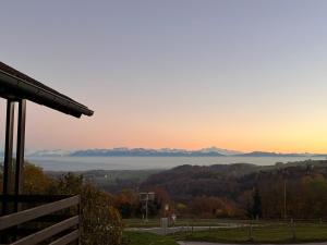 a view of the mountains at sunset from a house at La Croisée des Chemins 
