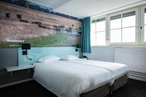 Postel nebo postele na pokoji v ubytování Hotel Hoogeerd by Flow Niftrik - Nijmegen + 36 fotografií
