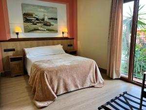 Postel nebo postele na pokoji v ubytování Hotel Pinomar