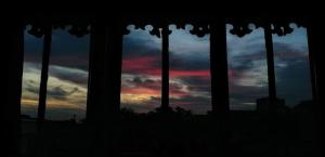 a group of pillars with a sunset in the background at Ici c'est Cosy - Centre in Toulouse