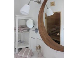 a bathroom with a mirror and a sink at Cathedral day "Hygge" in Kronsgaard +18 photos