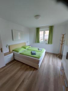 Posteľ alebo postele v izbe v ubytovaní Appartements Bleistattblick