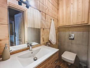 a bathroom with a sink and a toilet at Domek u Cianka w Kościelisku in Kościelisko +70 photos