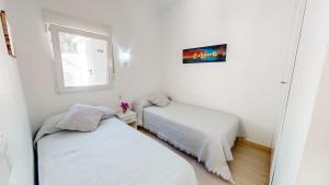Posteľ alebo postele v izbe v ubytovaní Apartamento Nueva Vida by Family Homes