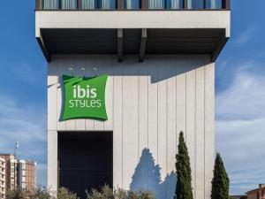 a building with a sign on the side of it at Ibis Styles Roma Aurelia in Rome