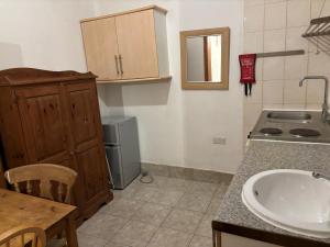 a kitchen with a sink and a counter top at Stay in Islington/Arsenal in London