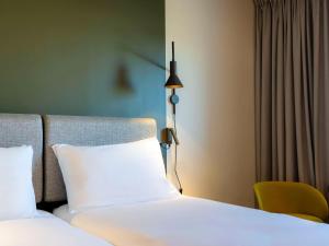 Postel nebo postele na pokoji v ubytování ibis Saint Paul Trois Chateaux