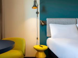 Postel nebo postele na pokoji v ubytování ibis Saint Paul Trois Chateaux