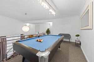 a living room with a pool table in it at Big family apartment Berlin Treptower Park in Berlin