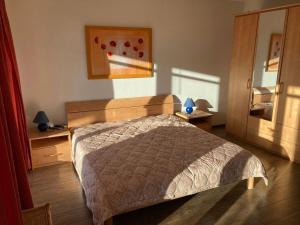 Кровать или кровати в номере Strandhaus Fiete - Haus Walfisch - ABC330