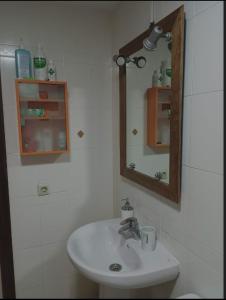 a bathroom with a sink and a mirror at El MIRADOR DE LA PLAYA in Melilla