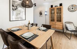 a dining room with a wooden table and chairs at Gebirgsresort Winterberg in Winterberg