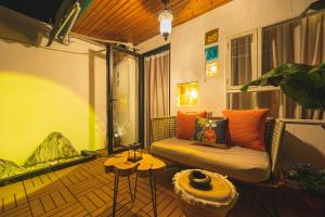 a living room with a couch and a table at Shanghai River View Villa in Shanghai