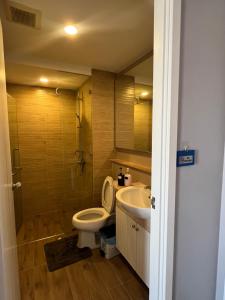 a bathroom with a toilet and a sink at I chill Six Room in Ban Bang Saen (1) +3 photos