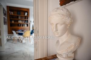 a plaster bust of a woman on a wall at Al centro Luxury Home in Caserta