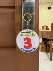a key chain with the number three on it at Apartamentos MI FAMILIA in Sucre