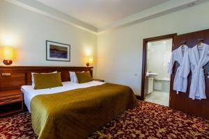 Postel nebo postele na pokoji v ubytování Hotel Violeta
