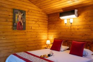 a bedroom with two beds in a wooden room at Eden Bungalows and Beach in Köyceğiz