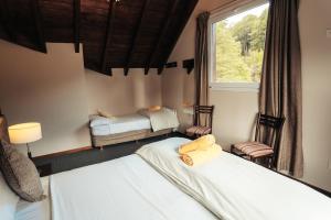 Postel nebo postele na pokoji v ubytování Hotel Puerto Blest