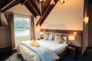 Postel nebo postele na pokoji v ubytování Hotel Puerto Blest