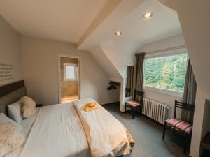 Postel nebo postele na pokoji v ubytování Hotel Puerto Blest