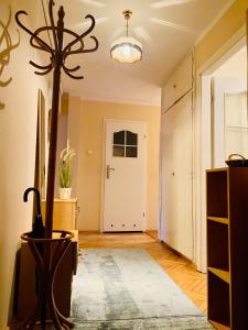a living room with a hallway with a door at Okrzei 15 - poczuj się jak w domu in Sopot
