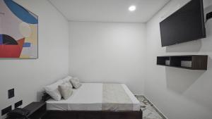 Voodi või voodid majutusasutuse ZAFIRO HOTEL toas
