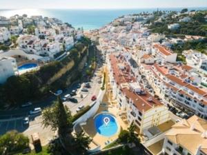 an aerial view of a city with buildings and a street at Charming two bedroom apartment in Carvoeiro