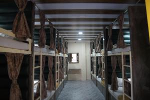 a row of bunk beds in a room at mittal dormitory in Mumbai