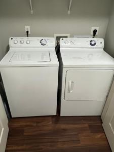 two white ovens sitting next to each other in a kitchen at Masterkeys Rentals LLC in Indianapolis
