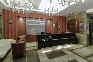 a lobby with a reception desk and chandeliers at Levni Hotel & SPA - Special Category in Istanbul