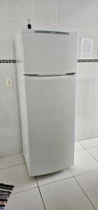 a white refrigerator sitting in a room at Casa em Caldas Novas in Caldas Novas