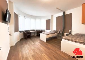 a room with two beds and a tv in it at Schöne, große Monteurwohnung in Bremen +3 photos