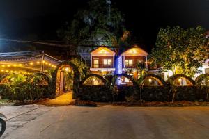 a house with lights on it at night at Tam Coc Green Mountain Homestay in Ninh Binh