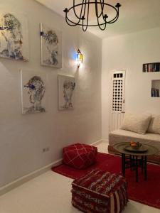 a living room with a couch and a table at Dar Said in Asilah